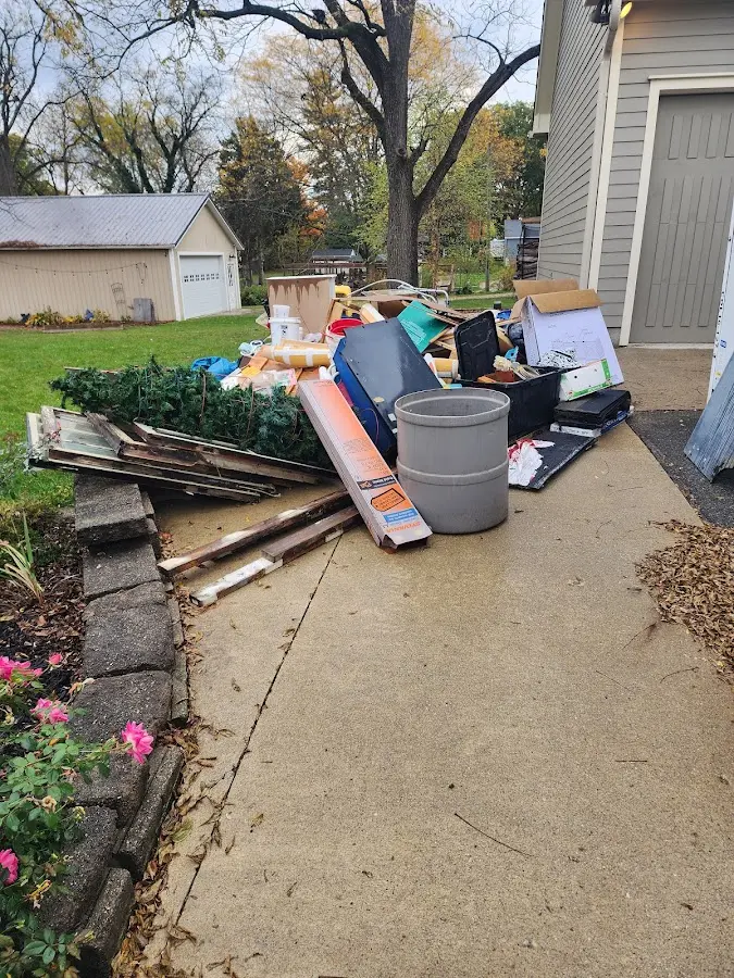 Dumpster being loaded with debris for Residential Dumpster Rental in Amarillo